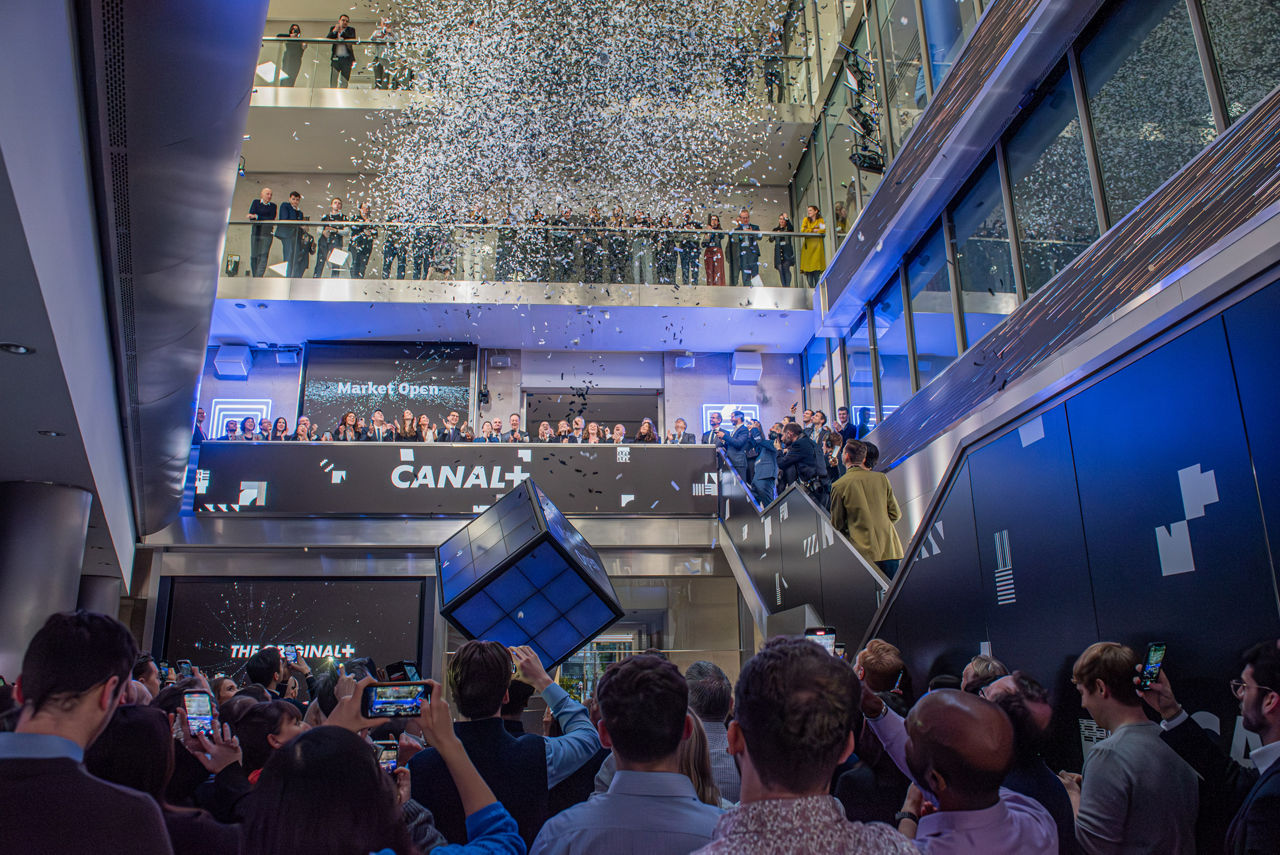 The team celebrating on the balcony at LSEG during the welcome ceremony.