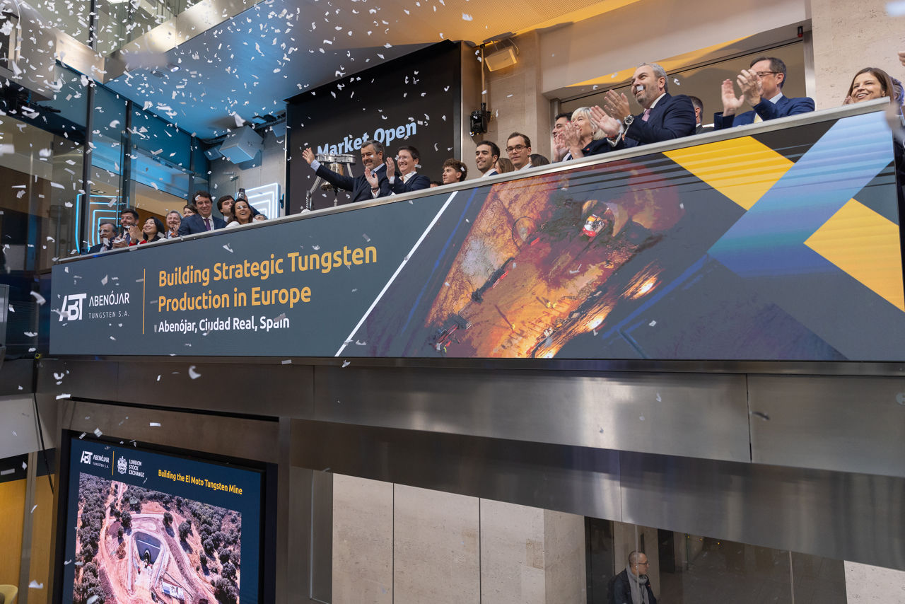 The team celebrating on the balcony at LSEG during the welcome ceremony.