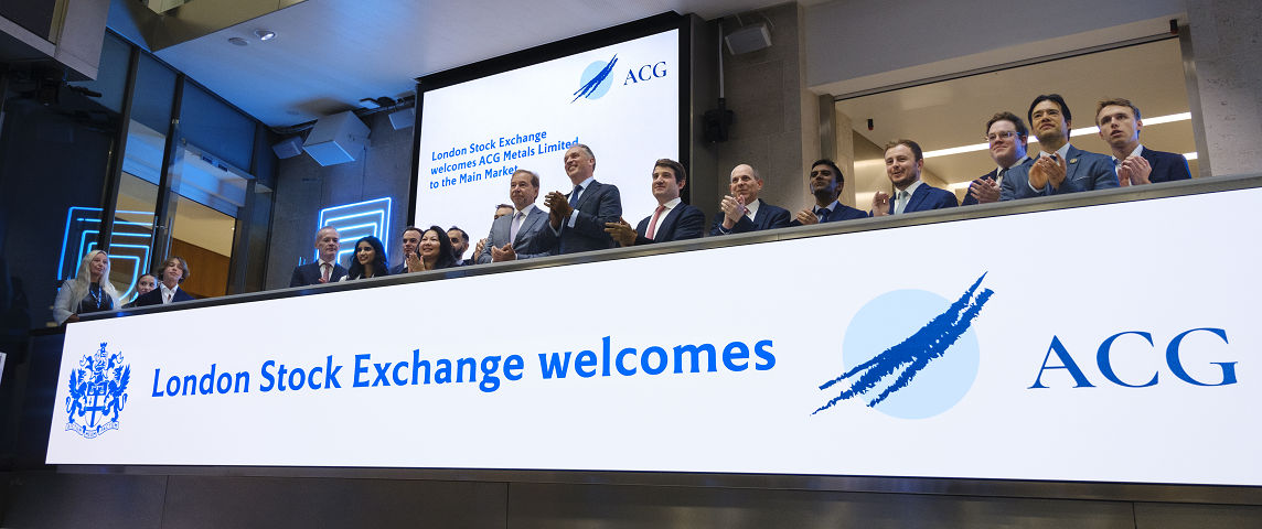The team celebrating on the balcony at LSEG during the welcome ceremony.