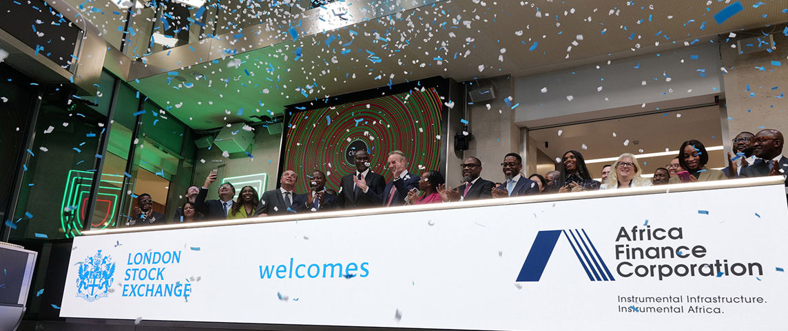 The team celebrating on the balcony at LSEG during the welcome ceremony.