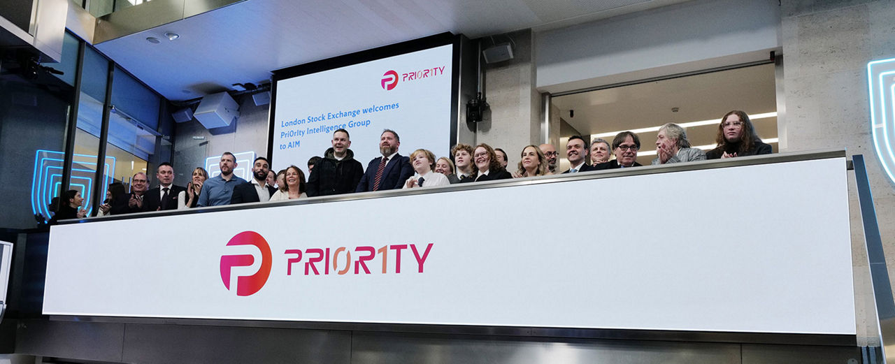 The team celebrating on the balcony at LSEG during the welcome ceremony.