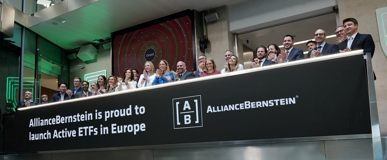 The team celebrating on the balcony at LSEG during the welcome ceremony.