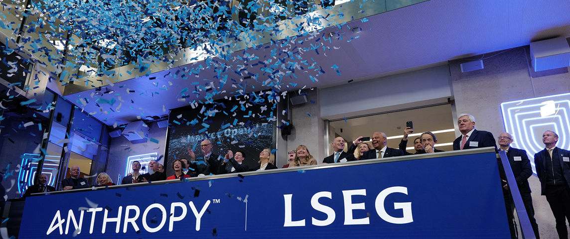 The team celebrating on the balcony at LSEG during the welcome ceremony.