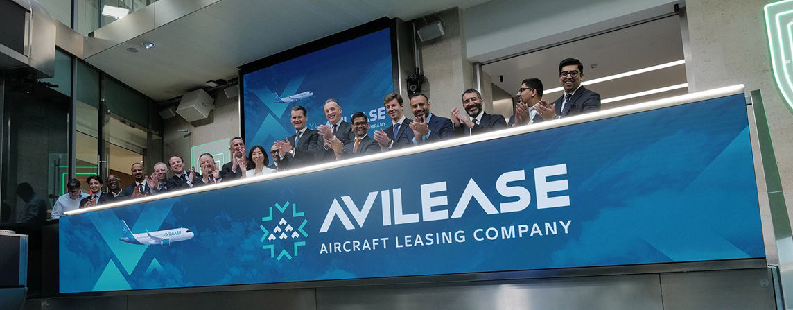 The team celebrating on the balcony at LSEG during the welcome ceremony.