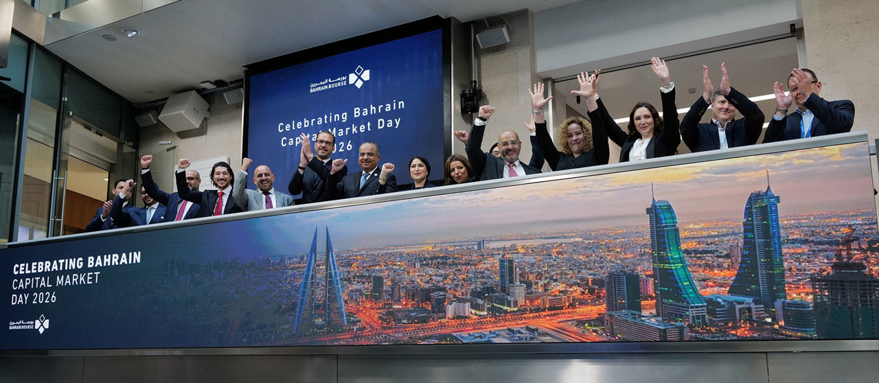 The team celebrating on the balcony at LSEG during the welcome ceremony.