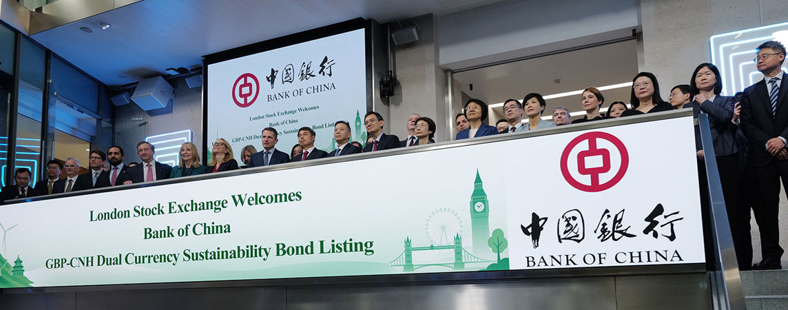 The team celebrating on the balcony at LSEG during the welcome ceremony.