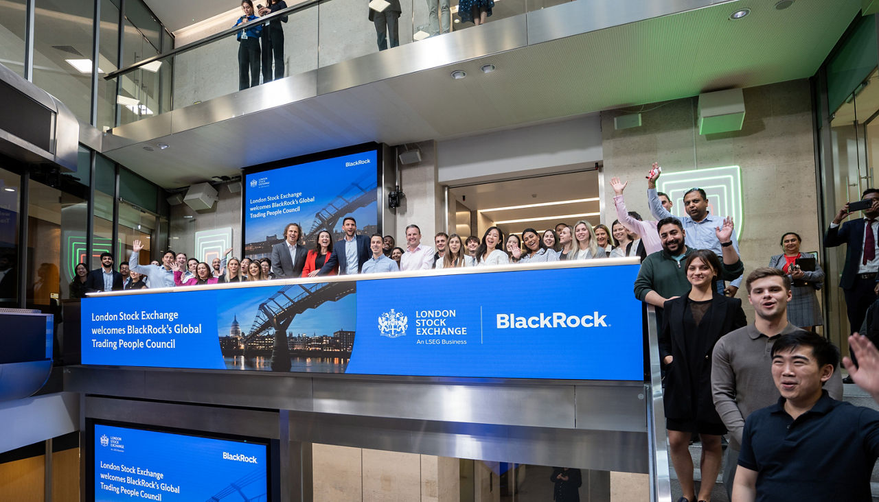 The team celebrating on the balcony at LSEG during the welcome ceremony.