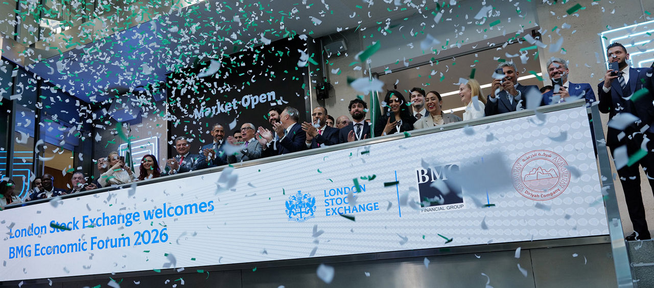 The team celebrating on the balcony at LSEG during the welcome ceremony.