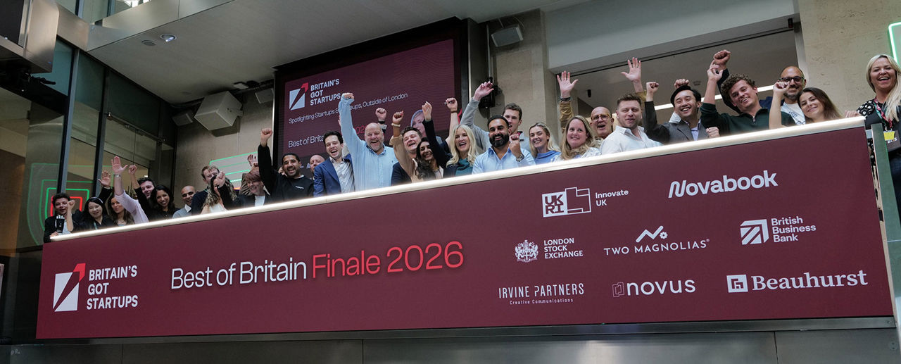 The team celebrating on the balcony at LSEG during the welcome ceremony.