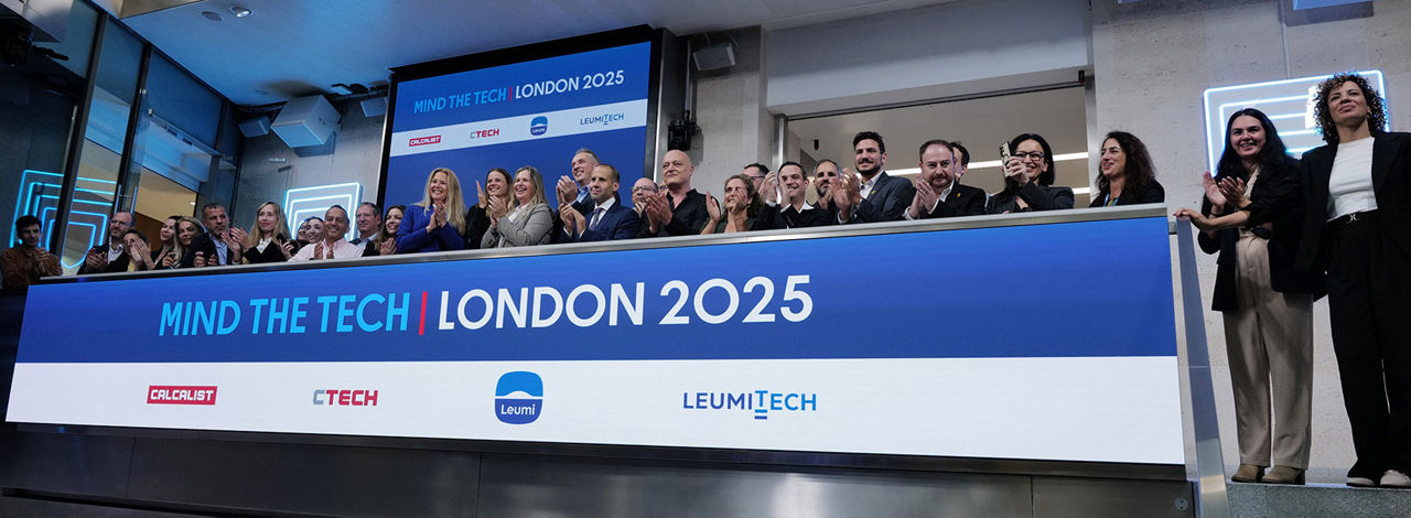 The team celebrating on the balcony at LSEG during the welcome ceremony.