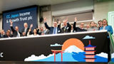 The team celebrating on the balcony at LSEG during the welcome ceremony.