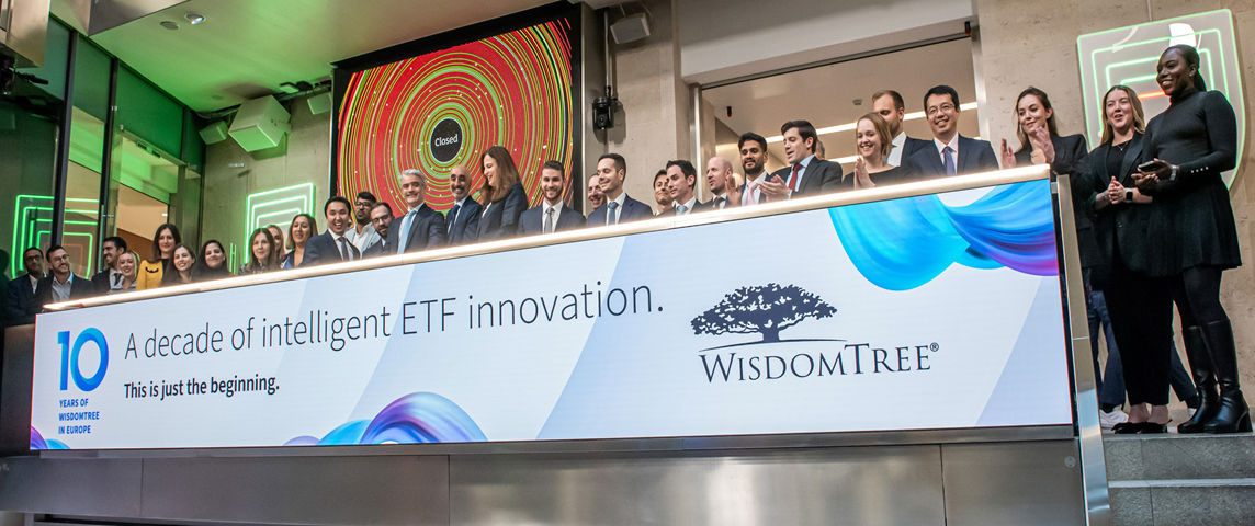 The team celebrating on the balcony at LSEG during the welcome ceremony.