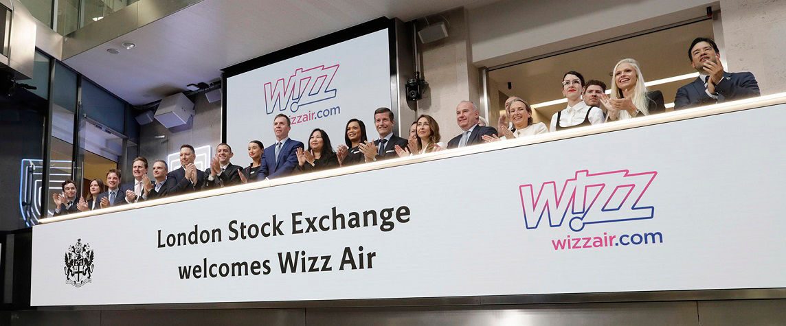 The team celebrating on the balcony at LSEG during the welcome ceremony.