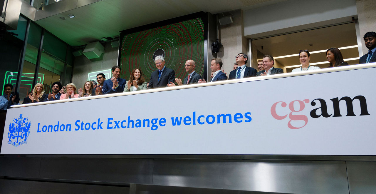 The team celebrating on the balcony at LSEG during the welcome ceremony.
