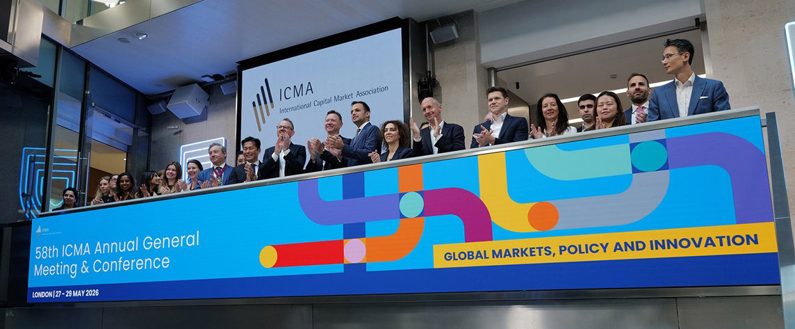 The team celebrating on the balcony at LSEG during the welcome ceremony.