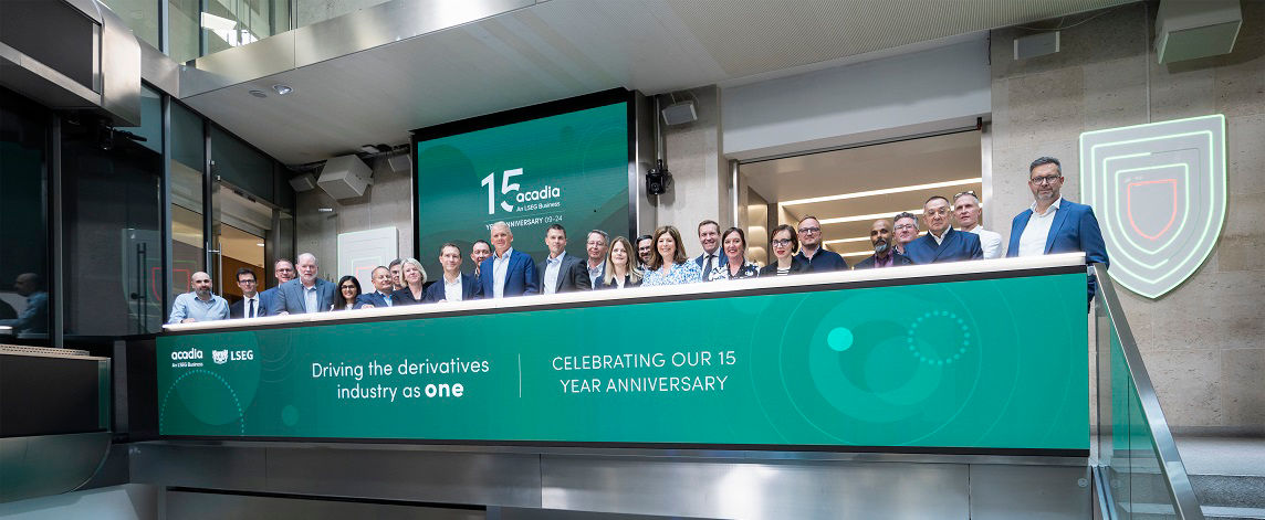 The team celebrating on the balcony at LSEG during the welcome ceremony.