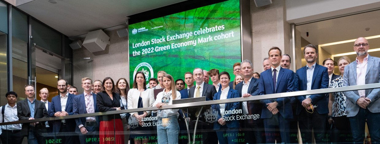 The team celebrating on the balcony at LSEG during the welcome ceremony.