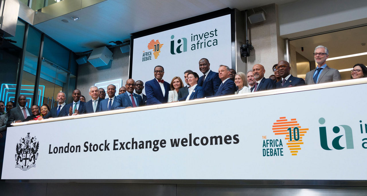 The team celebrating on the balcony at LSEG during the welcome ceremony.