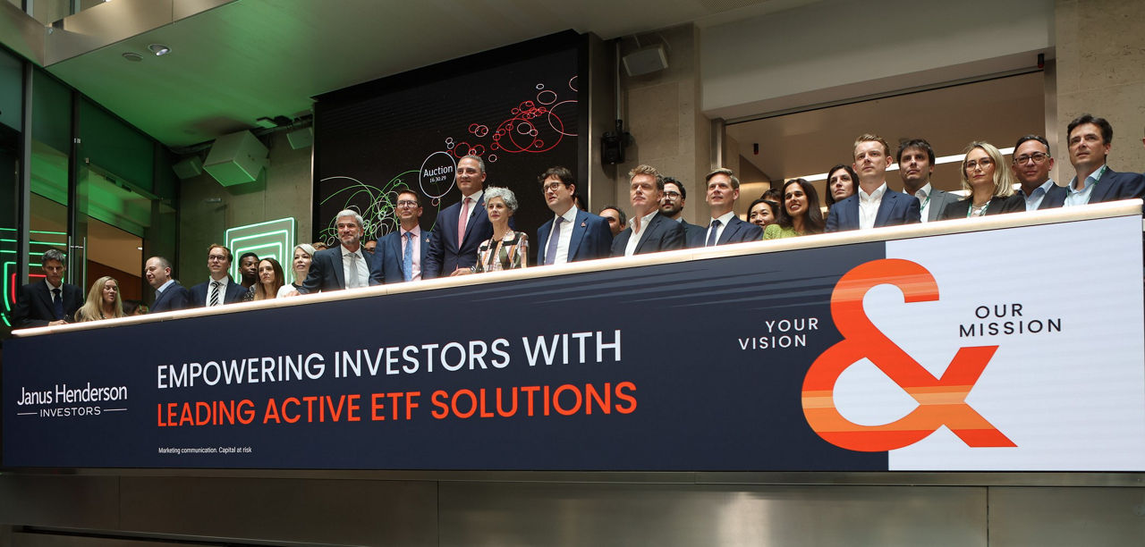 The team celebrating on the balcony at LSEG during the welcome ceremony.