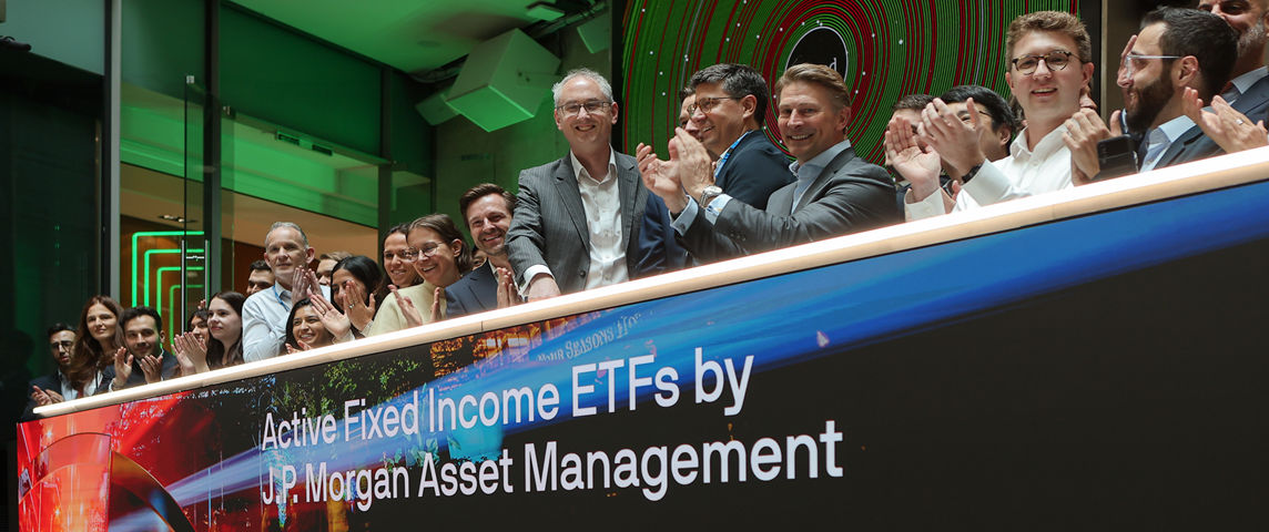 The team celebrating on the balcony at LSEG during the welcome ceremony.