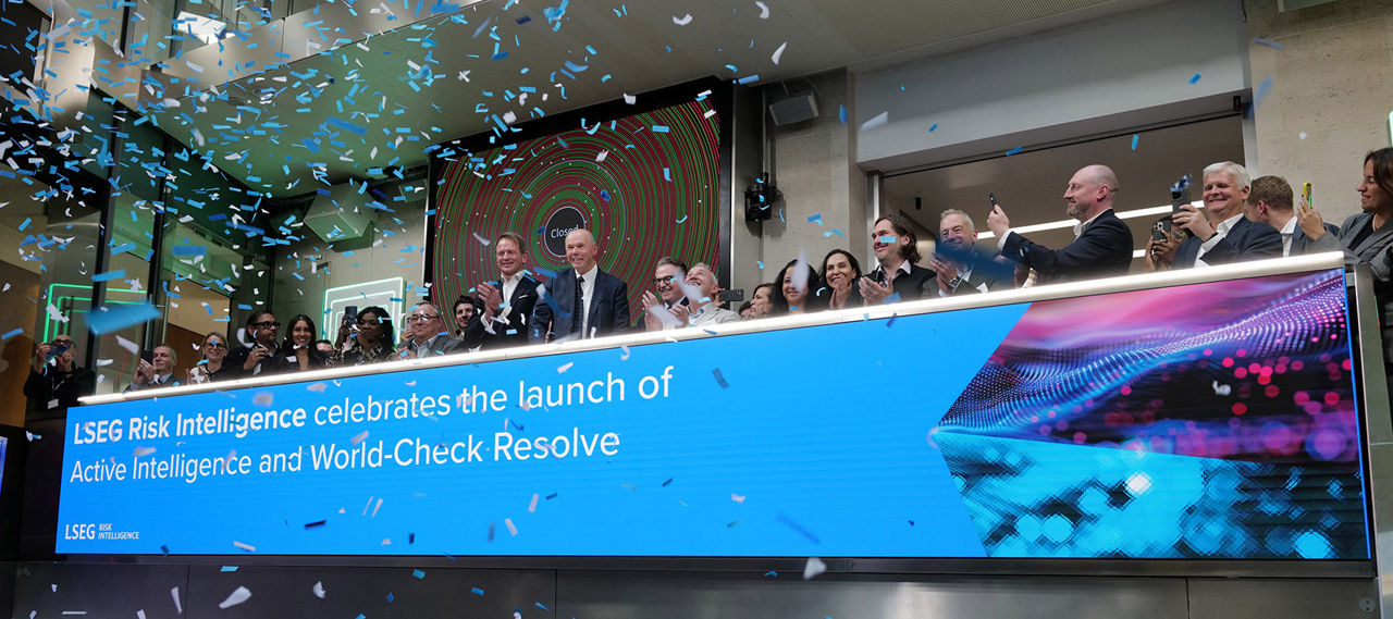 The team celebrating on the balcony at LSEG during the welcome ceremony.