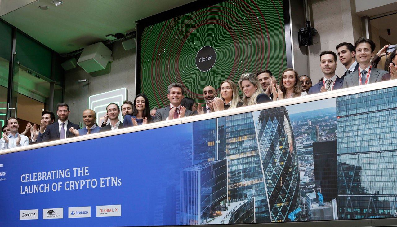 The team celebrating on the balcony at LSEG during the welcome ceremony.