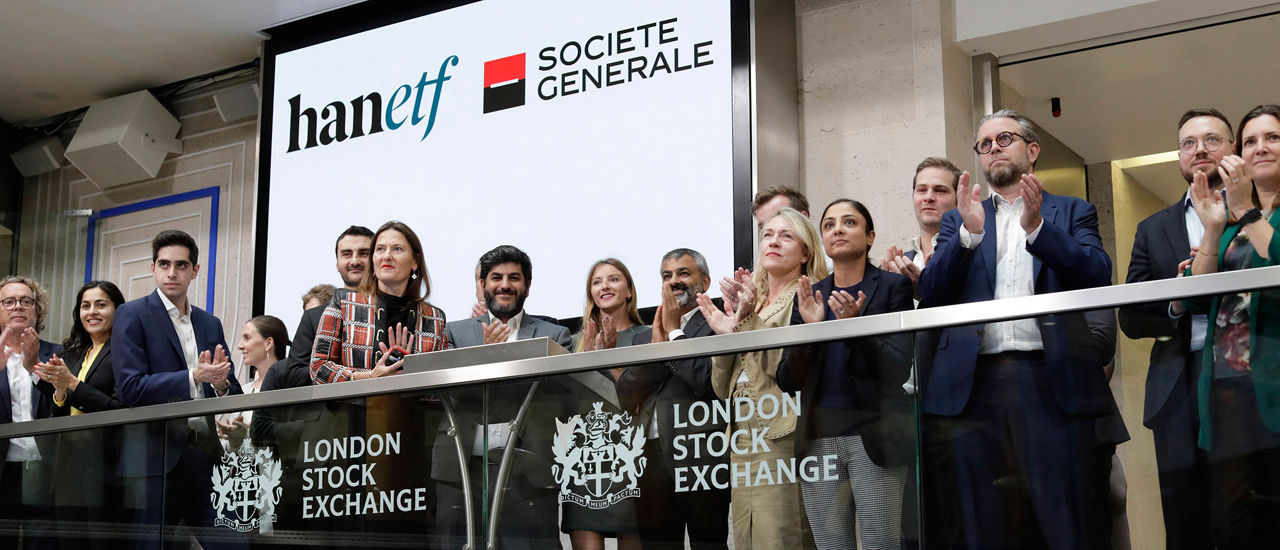 The team celebrating on the balcony at LSEG during the welcome ceremony.