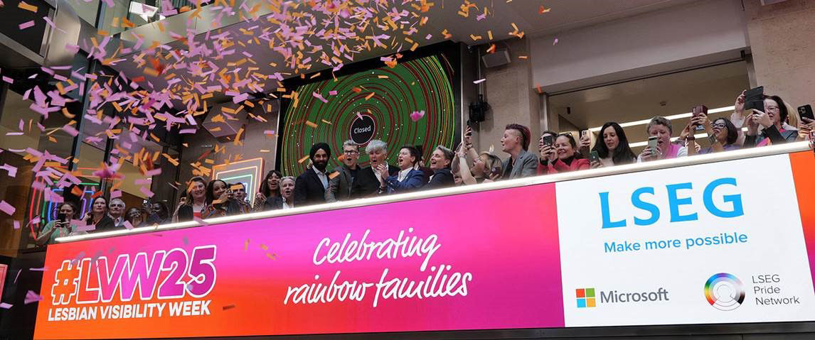 The team celebrating on the balcony at LSEG during the welcome ceremony.
