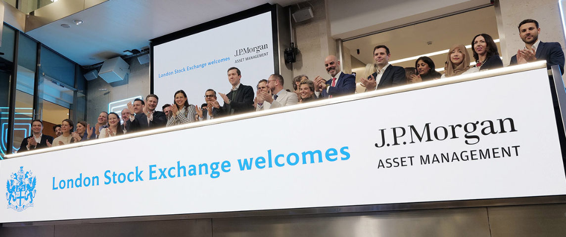 The team celebrating on the balcony at LSEG during the welcome ceremony.