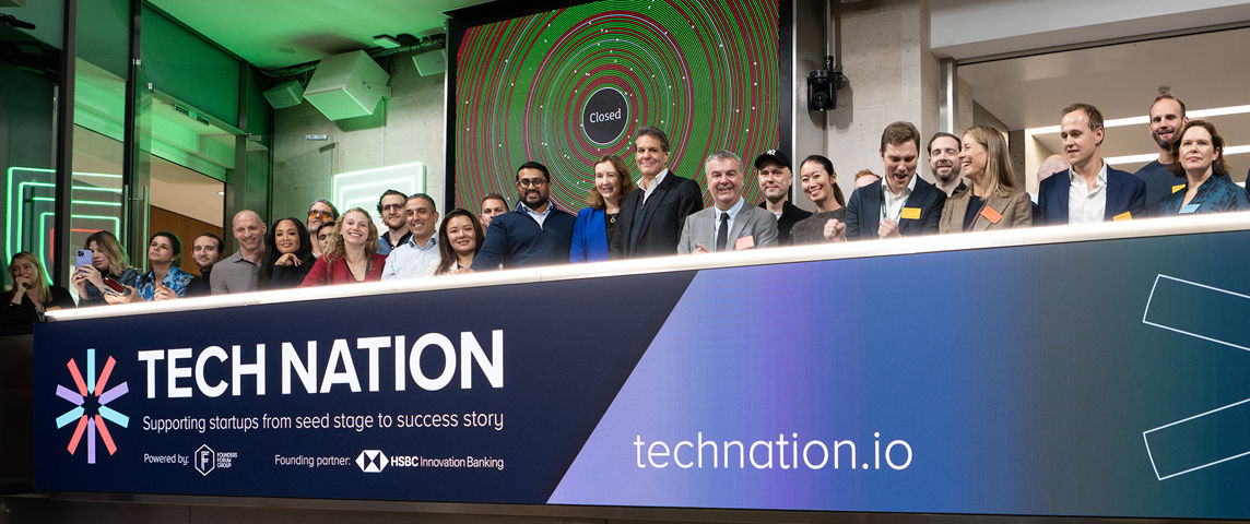 The team celebrating on the balcony at LSEG during the welcome ceremony.