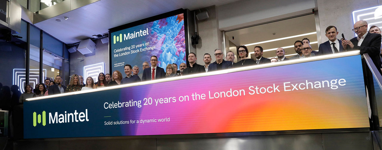 The team celebrating on the balcony at LSEG during the welcome ceremony.