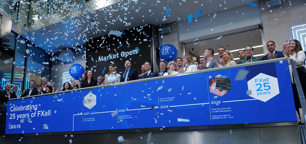 The team celebrating on the balcony at LSEG during the welcome ceremony.