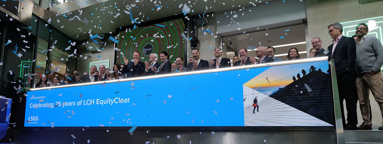 The team celebrating on the balcony at LSEG during the welcome ceremony.