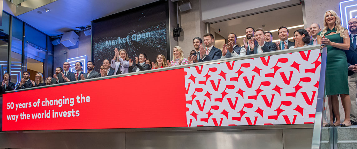 The team celebrating on the balcony at LSEG during the welcome ceremony.