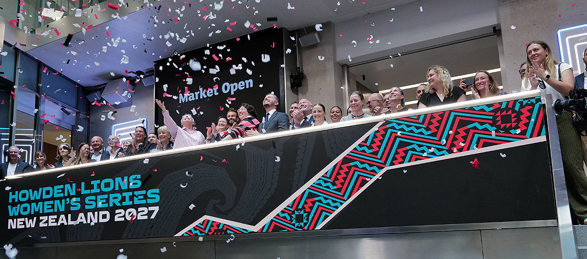 The team celebrating on the balcony at LSEG during the welcome ceremony.