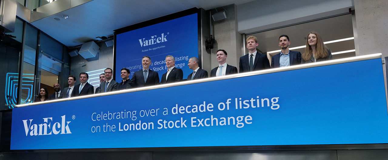 The team celebrating on the balcony at LSEG during the welcome ceremony.