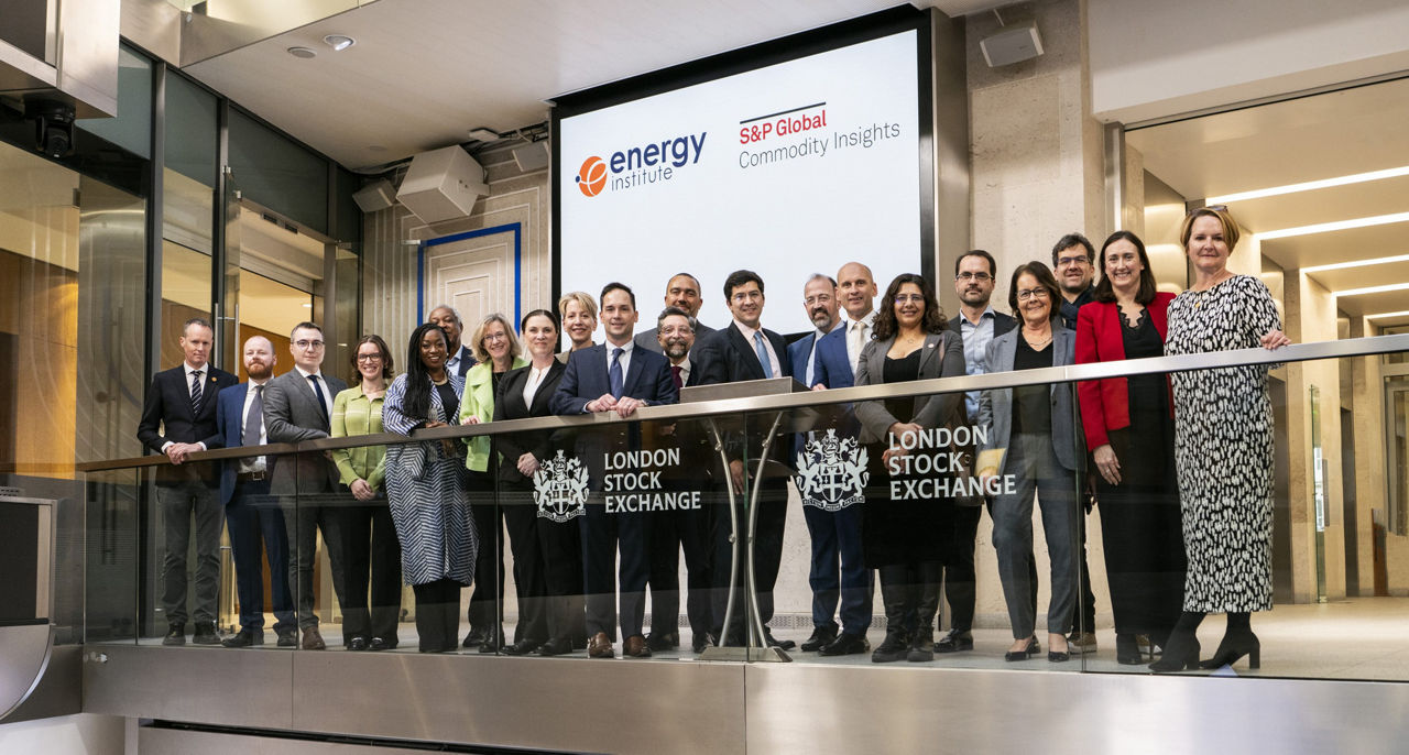 The team celebrating on the balcony at LSEG during the welcome ceremony.