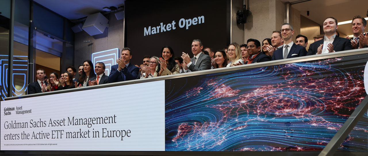 The team celebrating on the balcony at LSEG during the welcome ceremony.