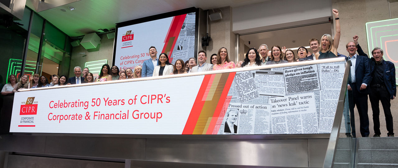 The team celebrating on the balcony at LSEG during the welcome ceremony.