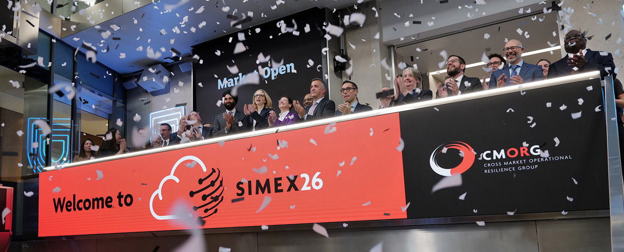 The team celebrating on the balcony at LSEG during the welcome ceremony.
