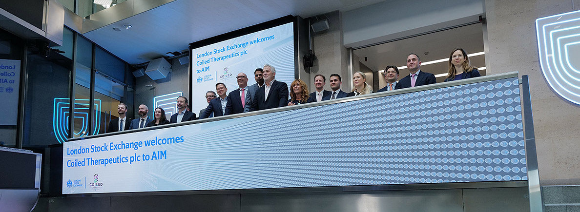 The team celebrating on the balcony at LSEG during the welcome ceremony.