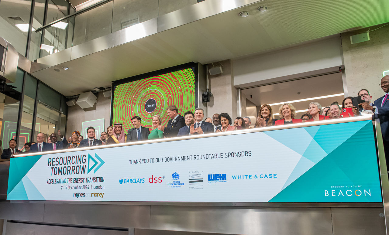 The team celebrating on the balcony at LSEG during the welcome ceremony.