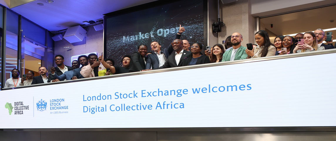 The team celebrating on the balcony at LSEG during the welcome ceremony.