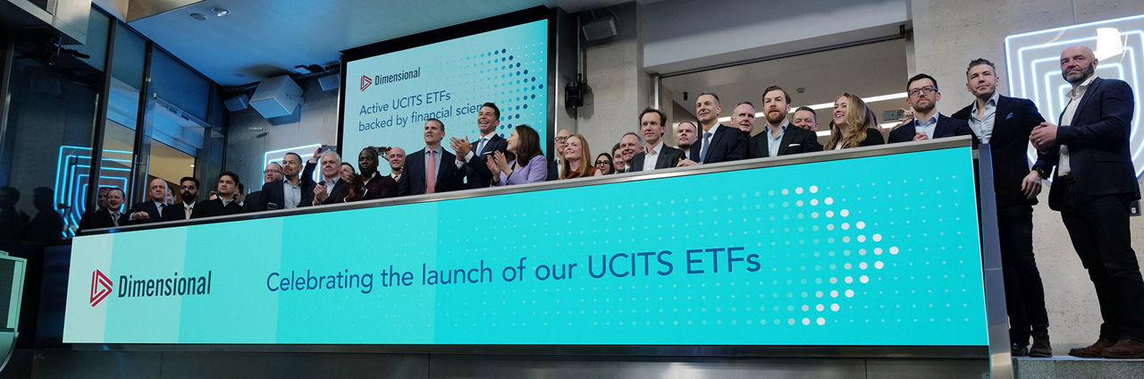 The team celebrating on the balcony at LSEG during the welcome ceremony.