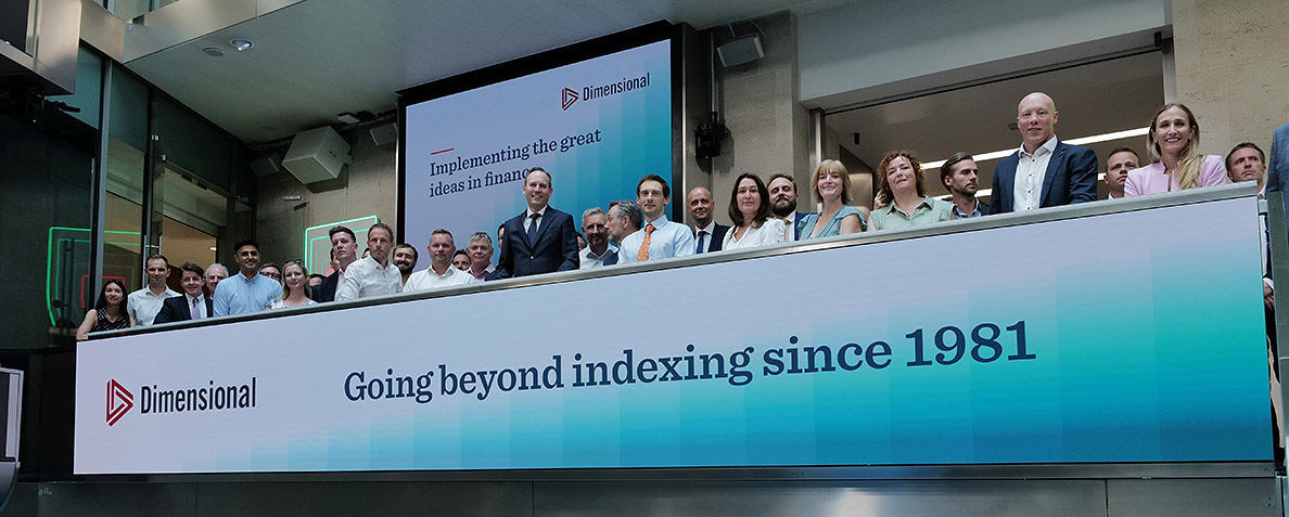 The team celebrating on the balcony at LSEG during the welcome ceremony.
