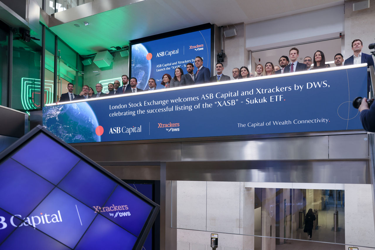 The team celebrating on the balcony at LSEG during the welcome ceremony.