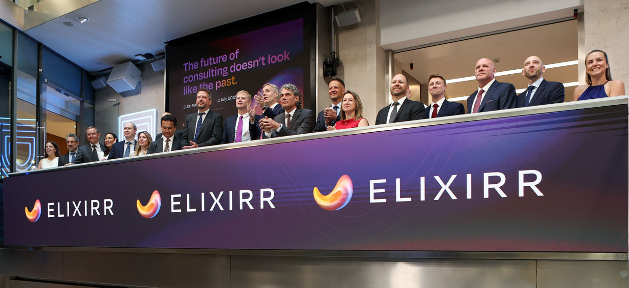 The team celebrating on the balcony at LSEG during the welcome ceremony.