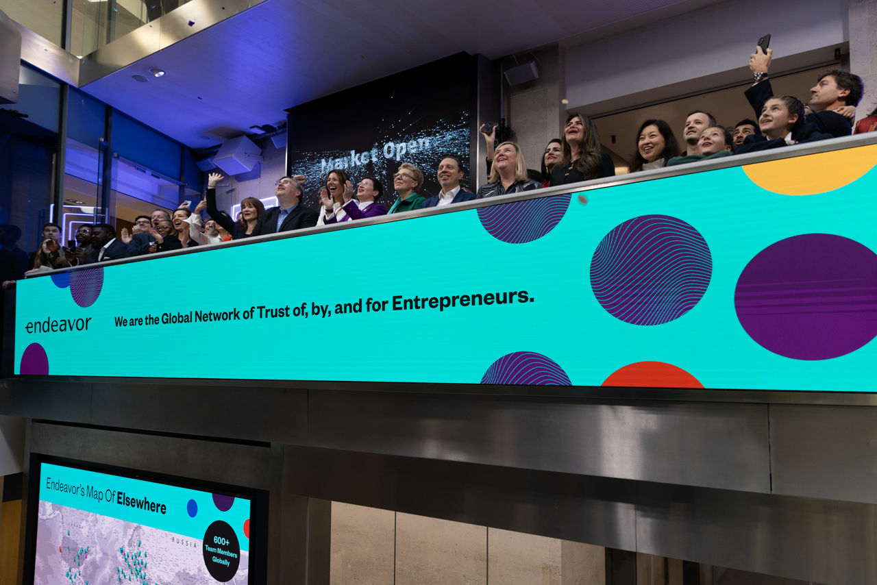 The team celebrating on the balcony at LSEG during the welcome ceremony.