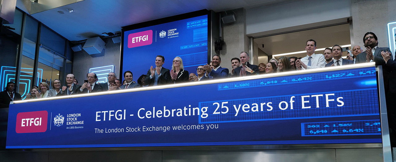 The team celebrating on the balcony at LSEG during the welcome ceremony.
