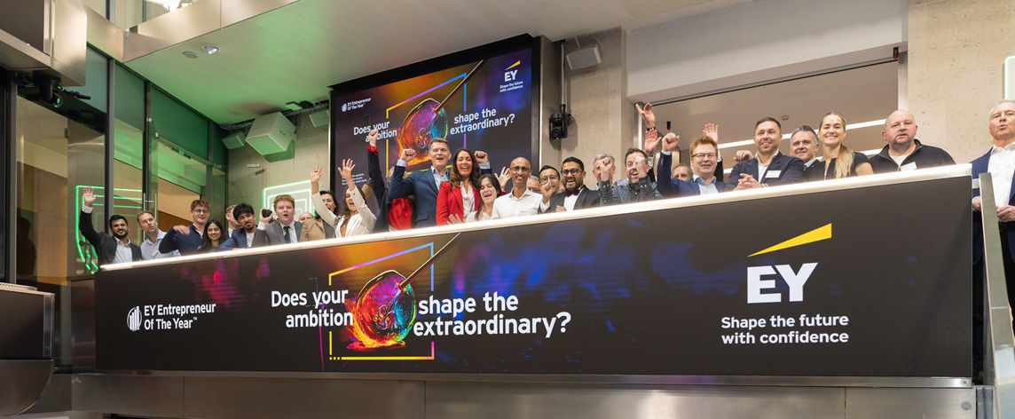 The team celebrating on the balcony at LSEG during the welcome ceremony.